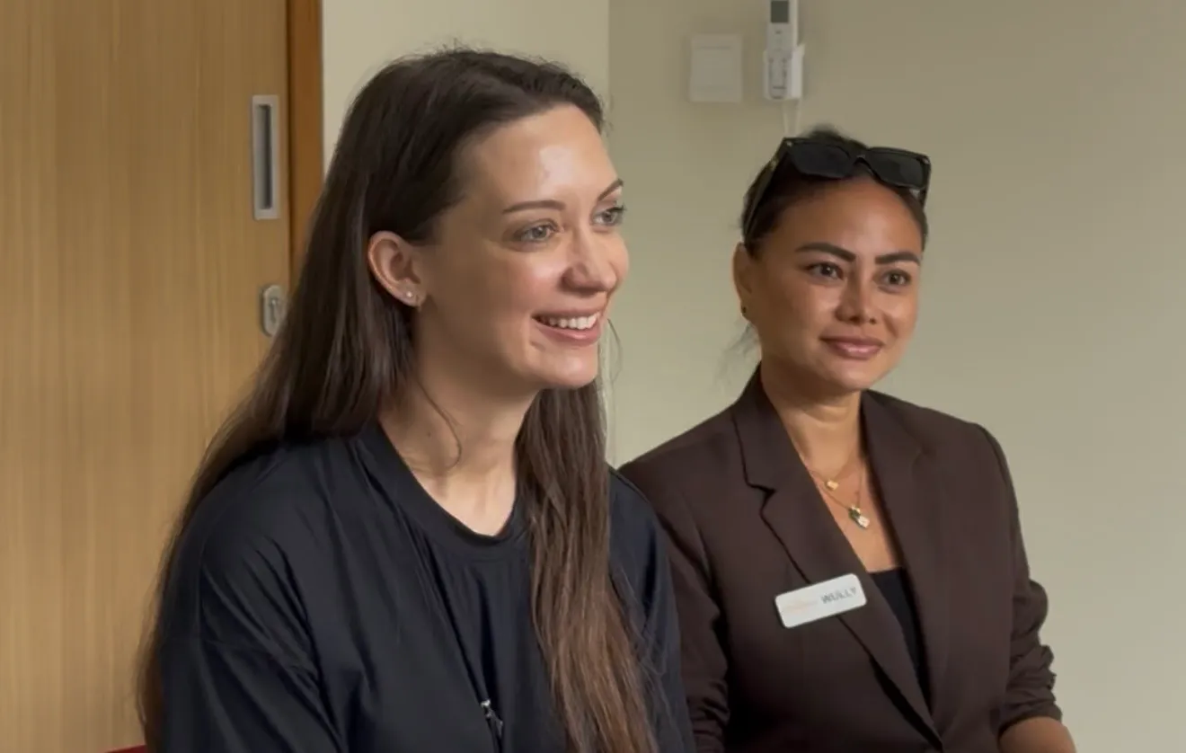 Patient smiling warmly with RCC Client Manager Wully