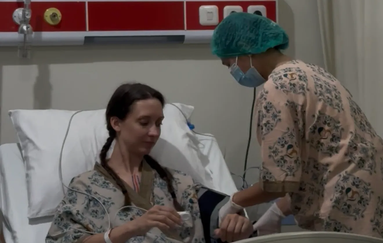 Patient receiving hospital post-operative care in recovery room